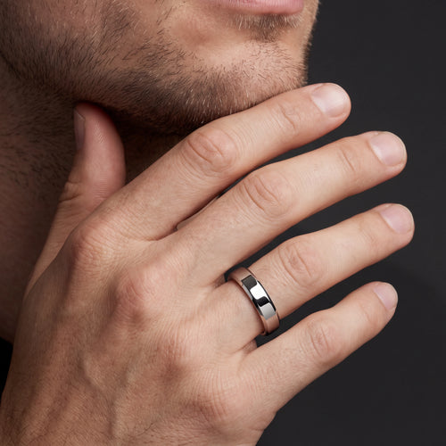 Man wearing the 5mm beveled edge wedding band in 14K white gold