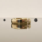 rounded edge 6mm comfort fit wedding ring in gold laid down and closed up view - Black Pearl of Queens