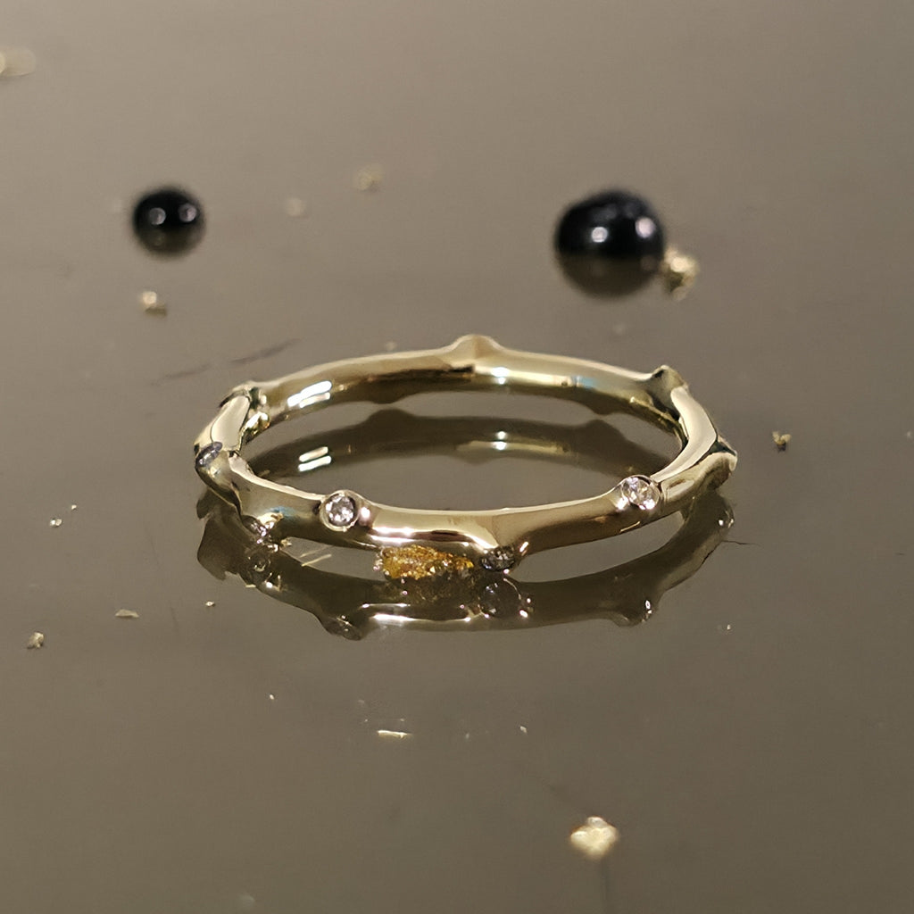Close-up angled view of Bamboo Diamond Ring Gold showing bamboo-style design with sparkling diamonds.