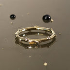 Close-up angled view of Bamboo Diamond Ring Gold showing bamboo-style design with sparkling diamonds.