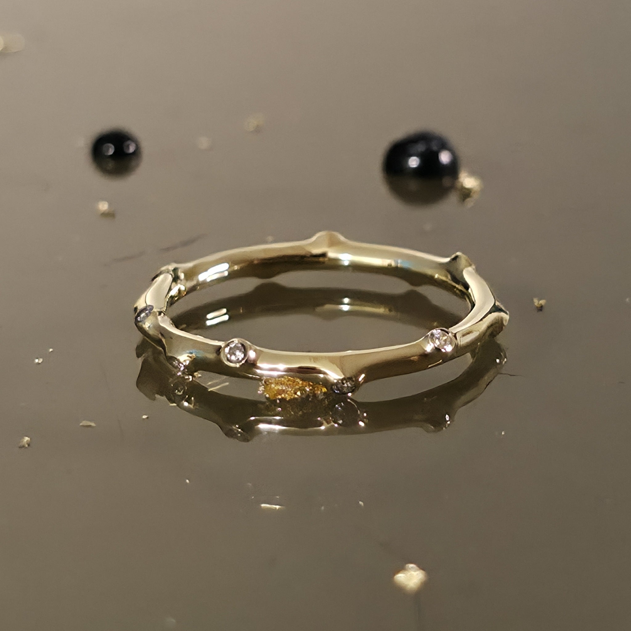 Close-up angled view of Bamboo Diamond Ring Gold showing bamboo-style design with sparkling diamonds.