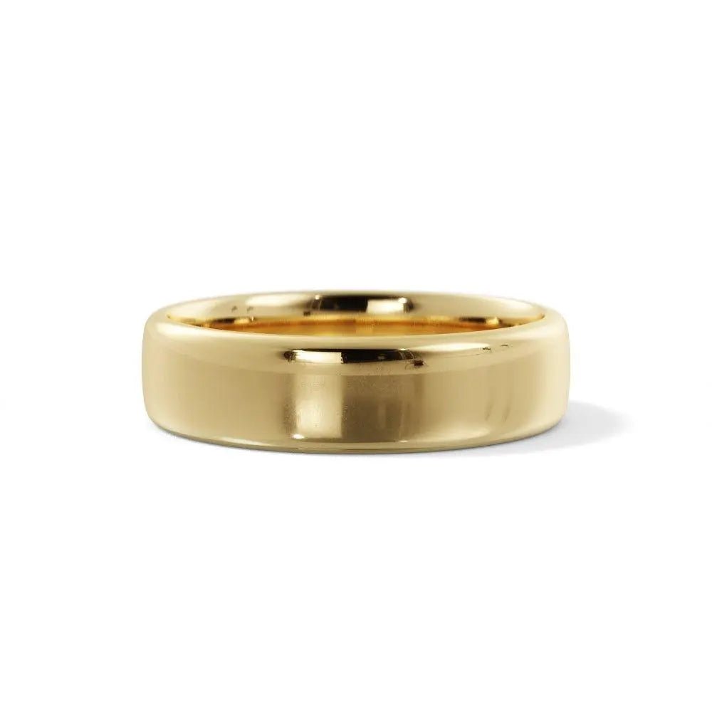 rounded edge wedding ring in gold laid down and closed up view - Black Pearl of Queens