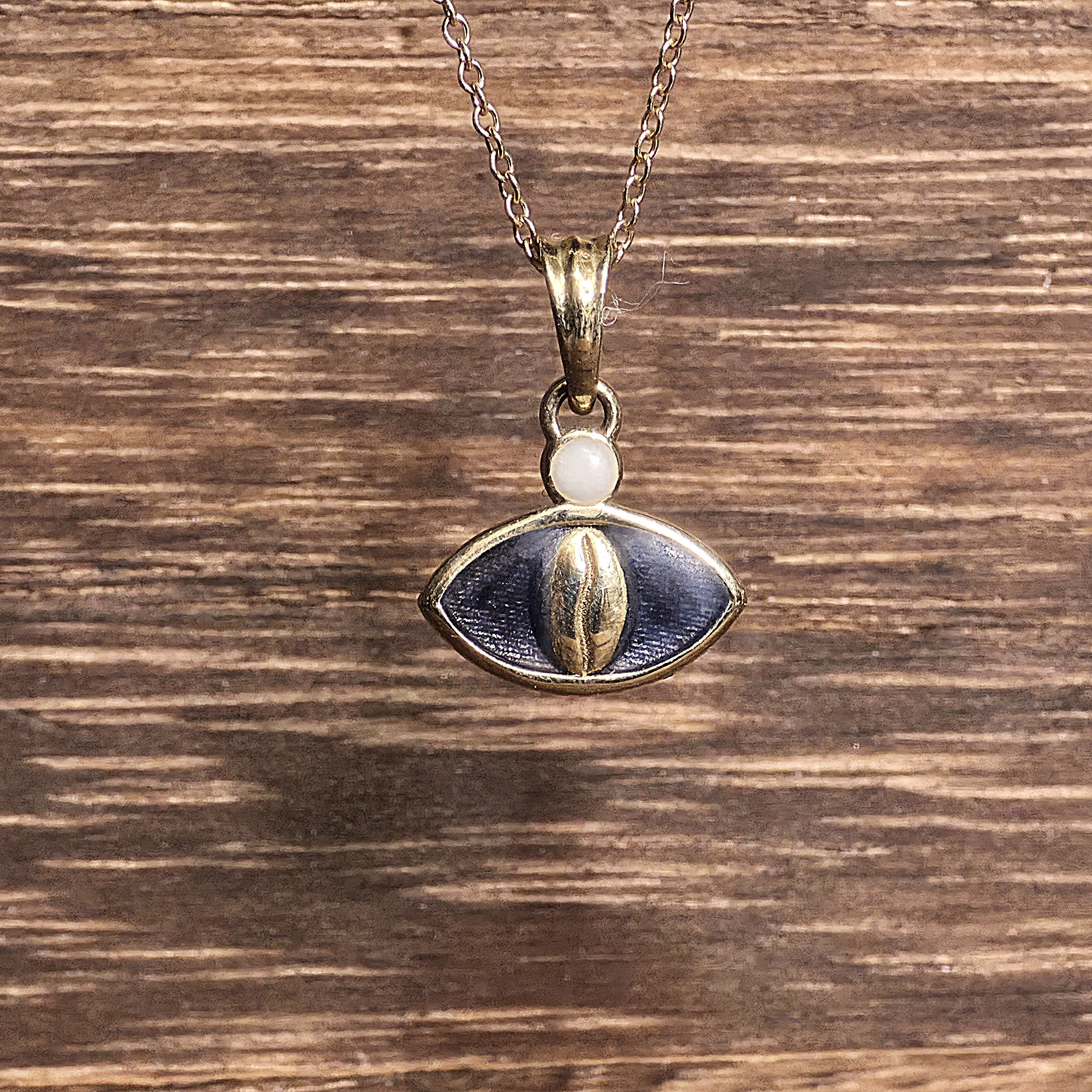 14K gold Coffee Bean Eye Pendant with chain — elegant minimalist jewelry symbolizing protection and good fortune.