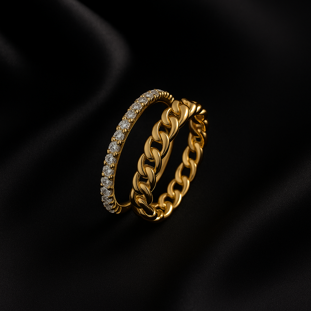 Two gold rings with diamond accents on a black background