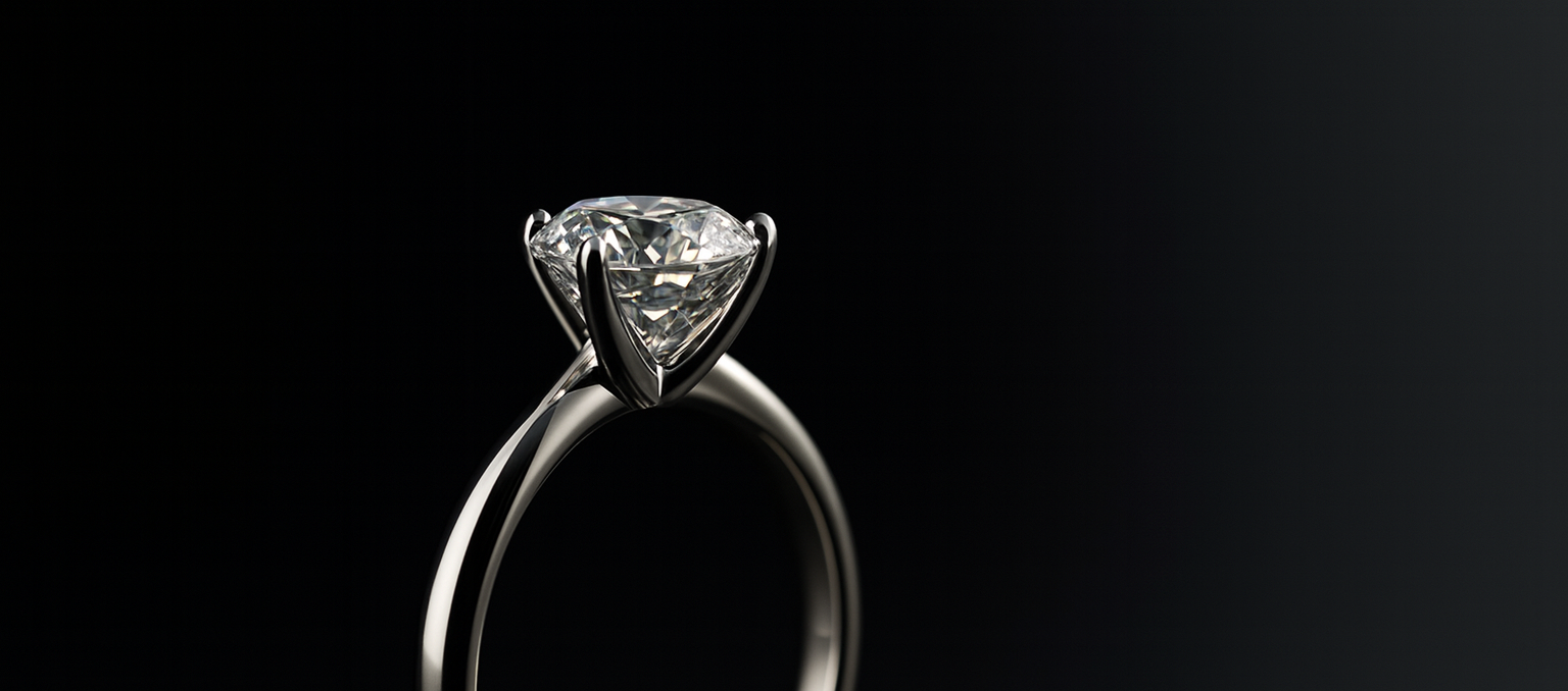 Diamond solitaire ring on a black background