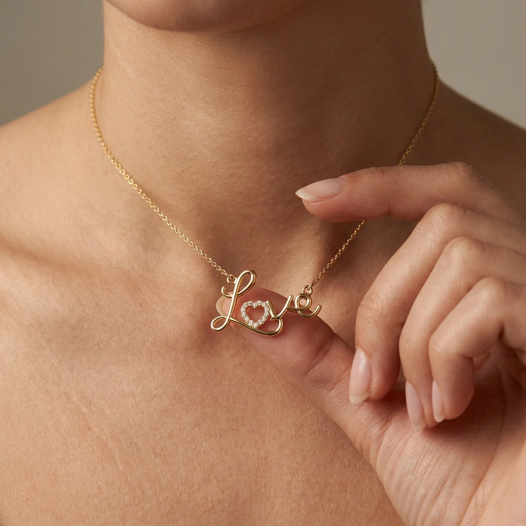 Amora Script Love Diamond Necklace worn on model - close-up showing elegant gold script on neckline