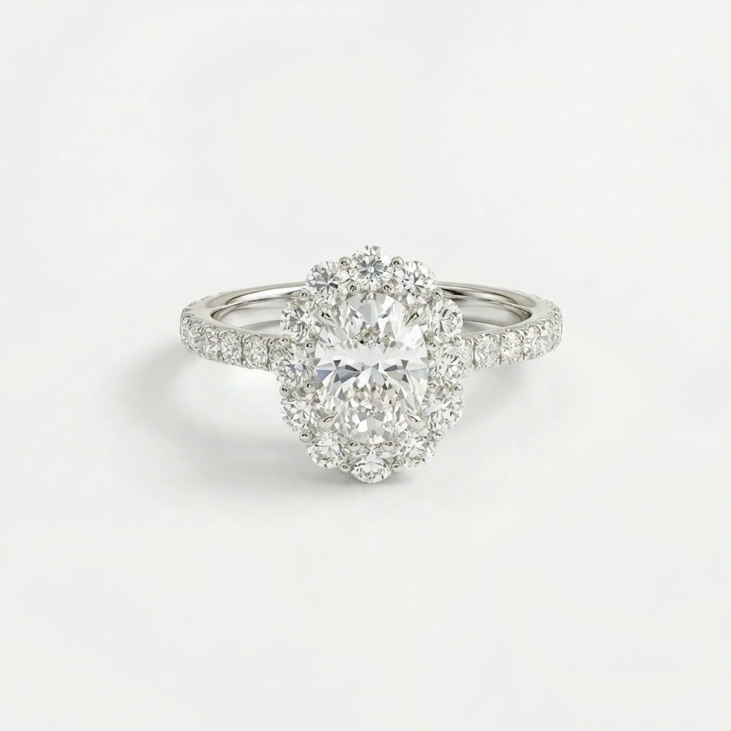 Aurelia Bloom oval diamond engagement ring in 14K white gold featuring halo cluster and pave diamond band