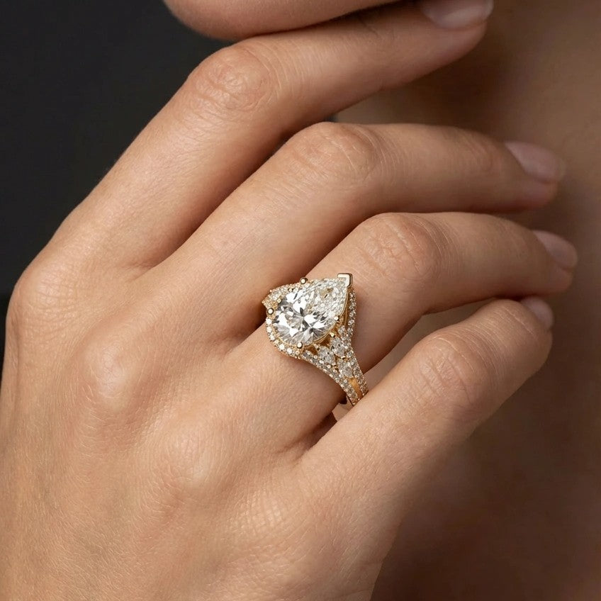 Aurelia Crown Pear Diamond Ring on finger close-up - showing finger-flattering pear shape and sparkle
