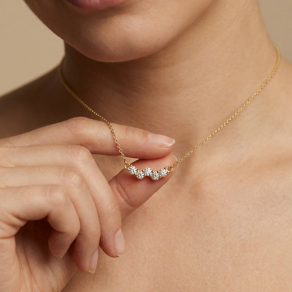 Aurelia Wave Diamond Bar Necklace worn by female model - showing elegant diamond wave pendant at collarbone.