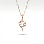 Aurex Cancer Zodiac Diamond Necklace in 14K rose gold, front view showing open oval Cancer symbol with diamond crown and beaded accents on cable chain