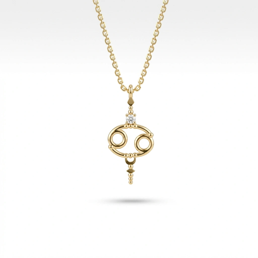 Aurex Cancer Zodiac Diamond Necklace in 14K yellow gold, front view showing open oval Cancer symbol with diamond crown and beaded accents on cable chain