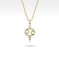 Aurex Cancer Zodiac Diamond Necklace in 14K yellow gold, front view showing open oval Cancer symbol with diamond crown and beaded accents on cable chain