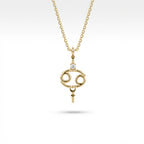 Aurex Cancer Zodiac Diamond Necklace in 14K yellow gold, front view showing open oval Cancer symbol with diamond crown and beaded accents on cable chain