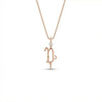 Aurex Capricorn Zodiac Diamond Necklace in 14K rose gold, front view showing sculptural Capricorn glyph with diamond crown and beaded drop on cable chain