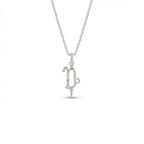 Aurex Capricorn Zodiac Diamond Necklace in 14K white gold, front view showing sculptural Capricorn glyph with diamond crown and beaded drop on cable chain