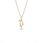 Aurex Capricorn Zodiac Diamond Necklace in 14K yellow gold, front view showing sculptural Capricorn glyph with diamond crown and beaded drop on cable chain