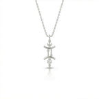 Aurex Gemini Zodiac Diamond Necklace in 14K white gold, front view showing twin pillar Gemini symbol with diamond drop and faceted bail on cable chain