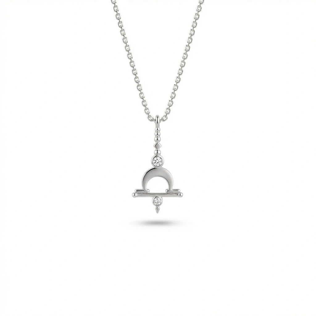 Aurex Libra Zodiac Diamond Necklace in 14K white gold, front view showing Libra scales symbol with crescent arch, horizontal bar, and twin lab-grown diamonds on cable chain
