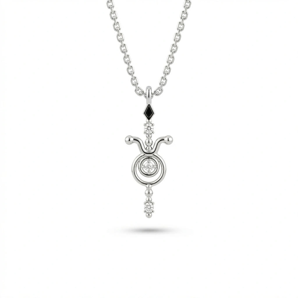 Aurex Taurus Zodiac Diamond Necklace in 14K white gold, front view showing bull horns with ball tips, center diamond circle, black diamond bail, and diamond drop on cable chain