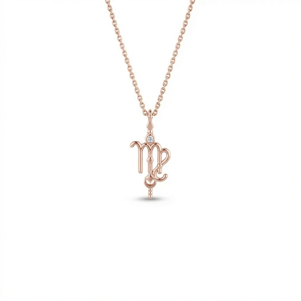 Aurex Virgo Zodiac Diamond Necklace in 14K rose gold, front view showing script-like Virgo glyph with bezel-set diamond crown, faceted bail, and beaded stem drop on cable chain