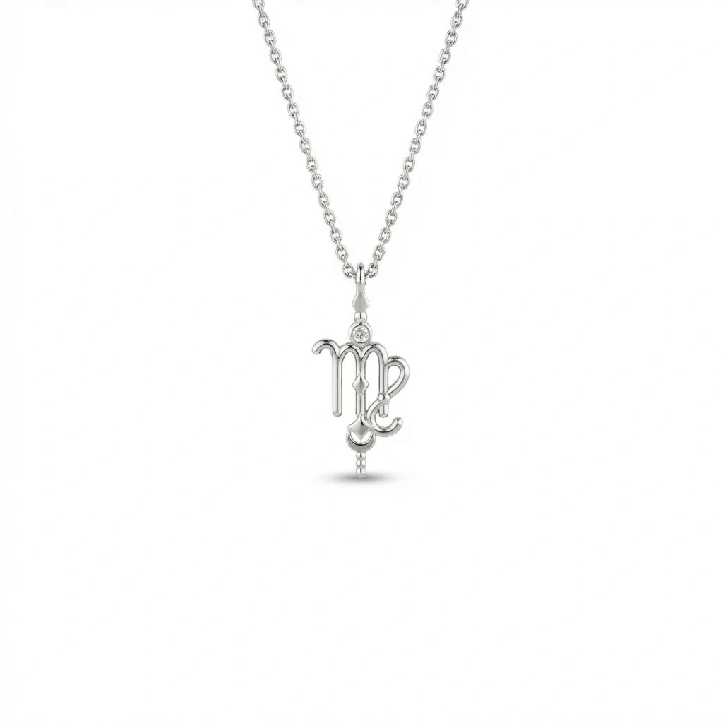 Aurex Virgo Zodiac Diamond Necklace in 14K white gold, front view showing script-like Virgo glyph with bezel-set diamond crown, faceted bail, and beaded stem drop on cable chain