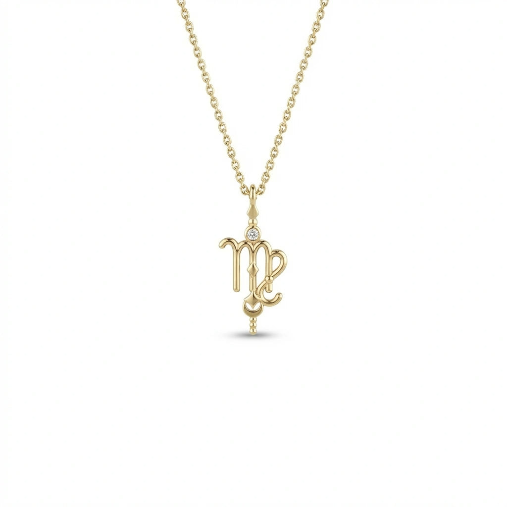 Aurex Virgo Zodiac Diamond Necklace in 14K yellow gold, front view showing script-like Virgo glyph with bezel-set diamond crown, faceted bail, and beaded stem drop on cable chain