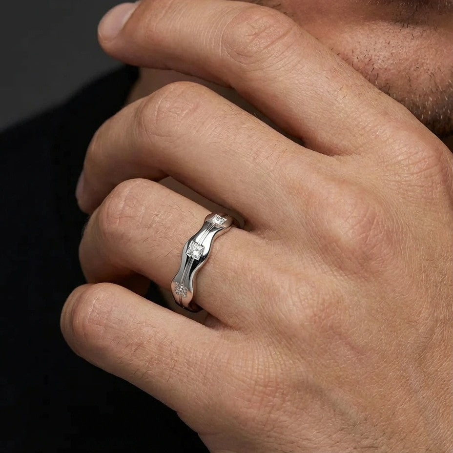 Aurex Wave Princess Diamond Band in 14K white gold - close-up on hand showing sculptural wave design and flush-set diamonds.