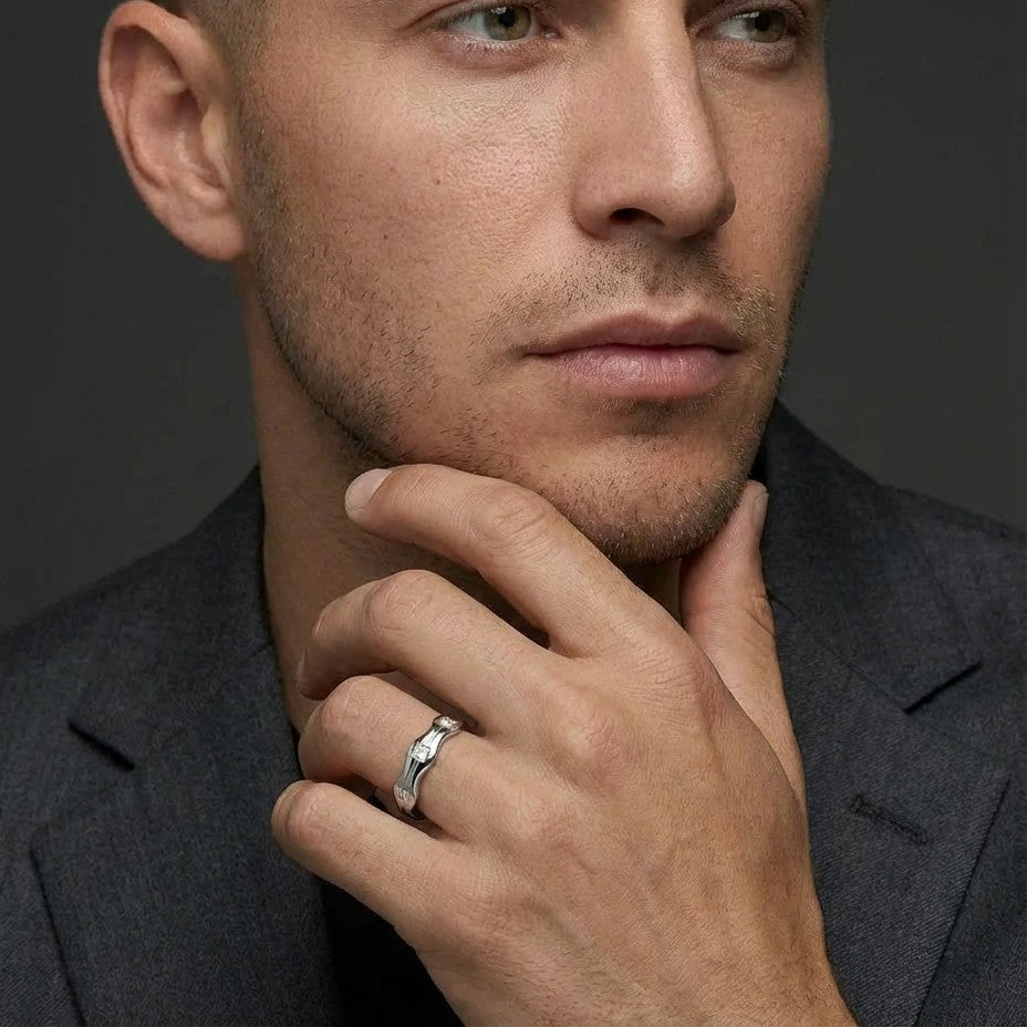 Aurex Wave Princess Diamond Band worn by male model in suit - showing bold unisex wave band on finger.