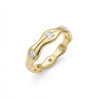 Aurex Wave Princess Diamond Band in 14K yellow gold - angle view showing undulating wave profile and princess-cut diamonds.