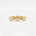 Aurex Wave Princess Diamond Band in 14K yellow gold - front view showing sculptural wave silhouette and diamond details.