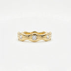 Aurex Wave Princess Diamond Band in 14K yellow gold - front view showing sculptural wave silhouette and diamond details.