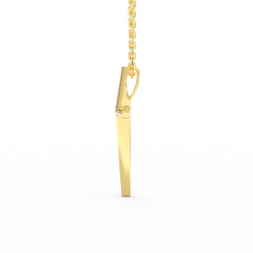 Side view of 14K yellow gold minimal cross pendant showing tapered thickness