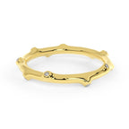 Bamboo Diamond Ring Gold in 14K, bamboo-inspired band with organic curves and petite diamonds on white surface.