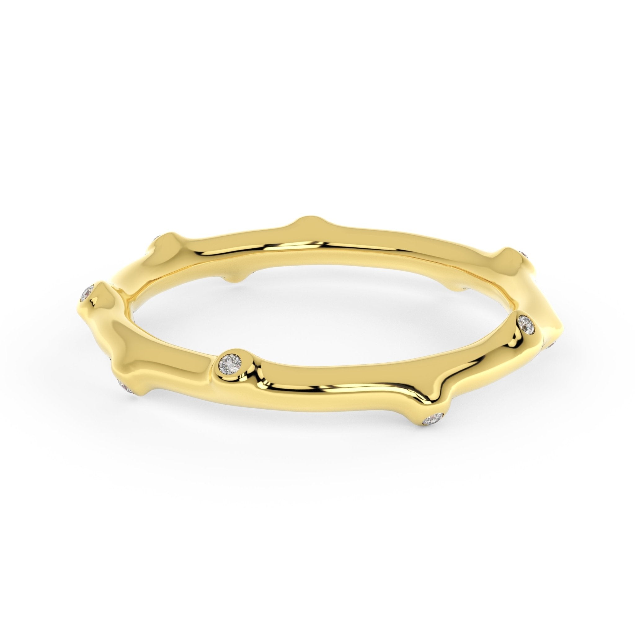 Bamboo Diamond Ring Gold in 14K, bamboo-inspired band with organic curves and petite diamonds on white surface.