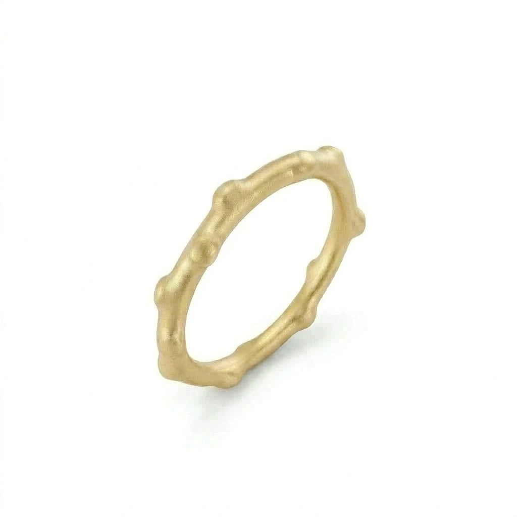 Bamboo gold ring in 14K yellow gold worn on hand, showing raised bamboo texture detail — Black Pearl of Queens
