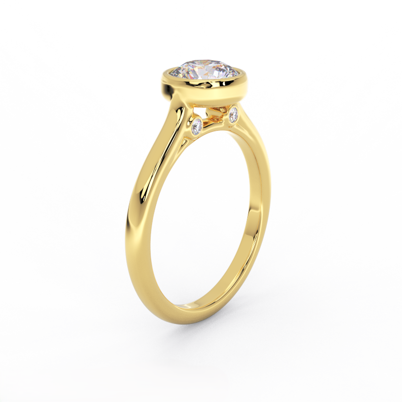 Bezel set round diamond solitaire ring in 14K yellow gold showing diamond under gallery detail