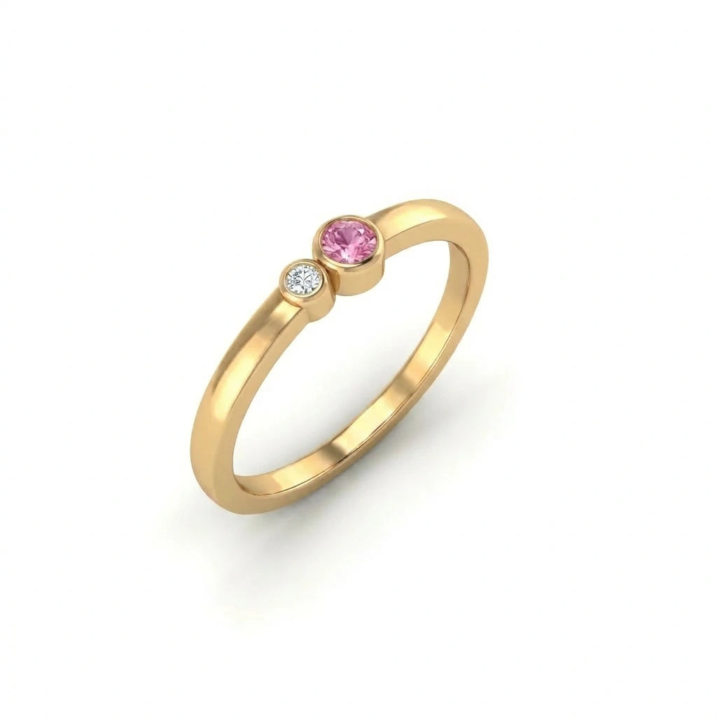 Minimalist bezel set pink sapphire and diamond ring angled perspective