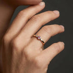 Woman wearing blush duo bezel diamond and pink sapphire ring in yellow gold