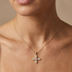 Model wearing a marquise-cut Lab-Grown Diamond flower cross pendant in 14K yellow gold on a cable chain — Black Pearl of Queens