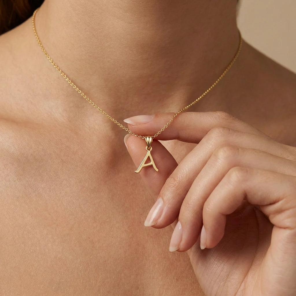 BPQ Script Initial Necklace in solid 14K yellow gold, letter A pendant worn on model, minimalist personalized jewelry