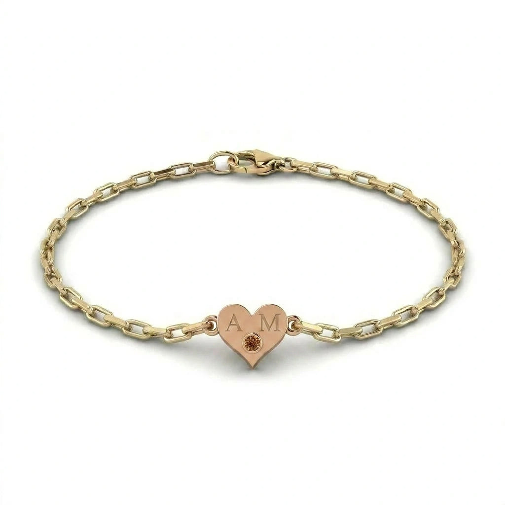 Brownstone champagne diamond heart bracelet in 14K brown gold heart charm with engraved initials on yellow gold paper clip chain — signature Brownstone alloy