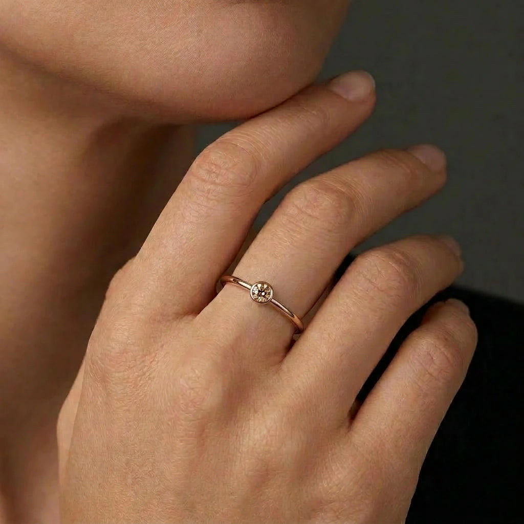 Champagne diamond bezel stacking ring in 14K brown gold worn on hand — Black Pearl of Queens