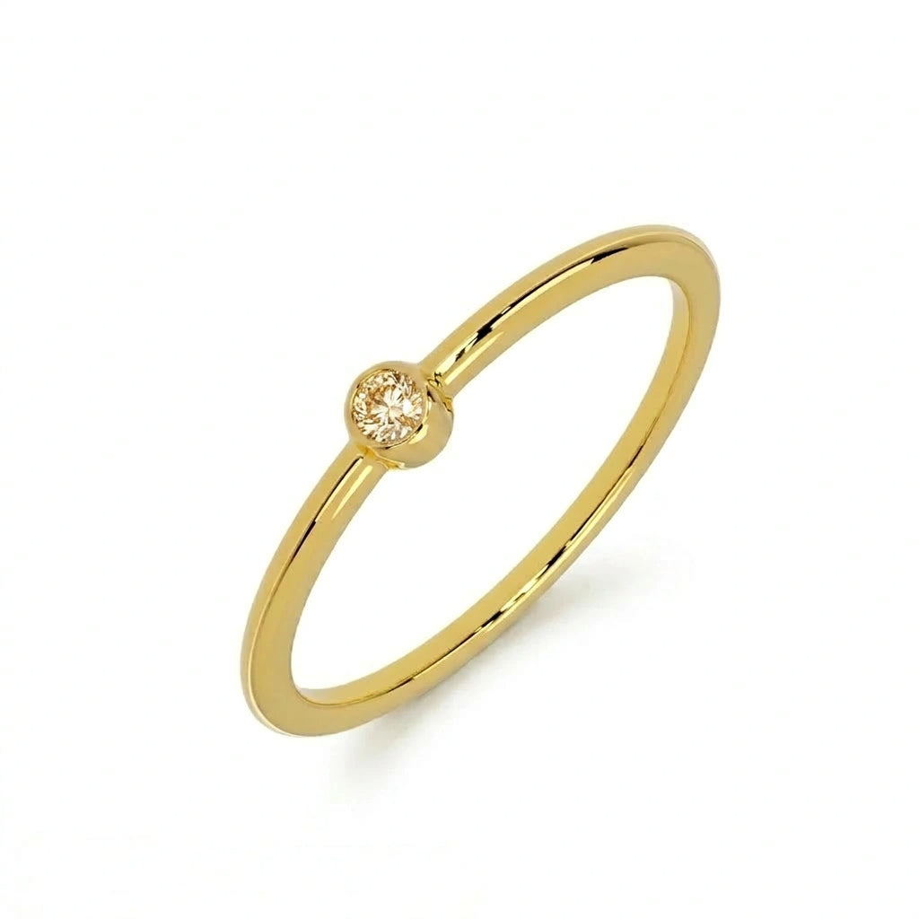 Champagne diamond bezel-set stacking ring in 14K yellow gold, three-quarter angle — Black Pearl of Queens