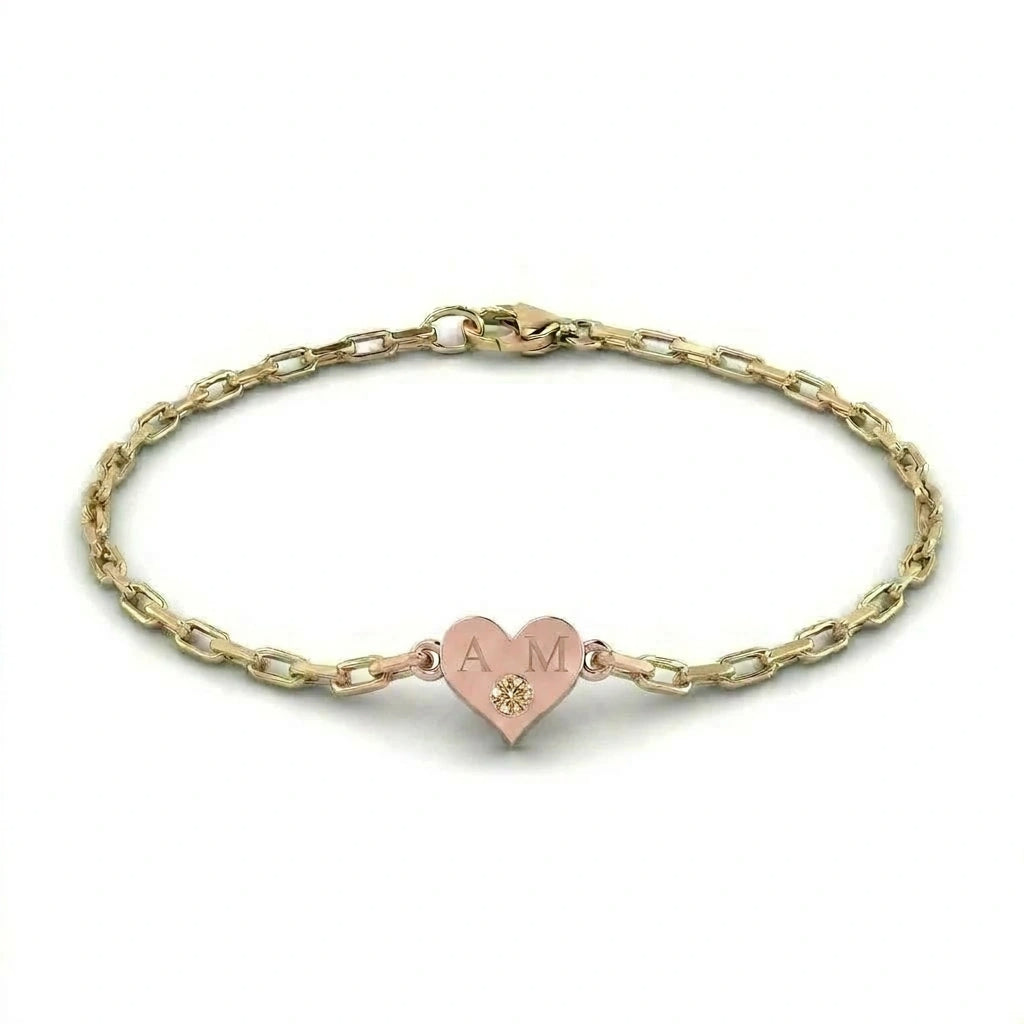 Brownstone champagne diamond heart bracelet in 14K rose gold heart charm with engraved initials on yellow gold paper clip chain