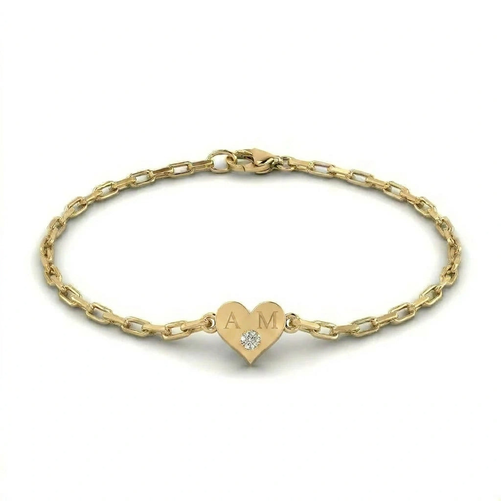 Brownstone champagne diamond heart bracelet in 14K yellow gold heart charm with engraved initials on yellow gold paper clip chain