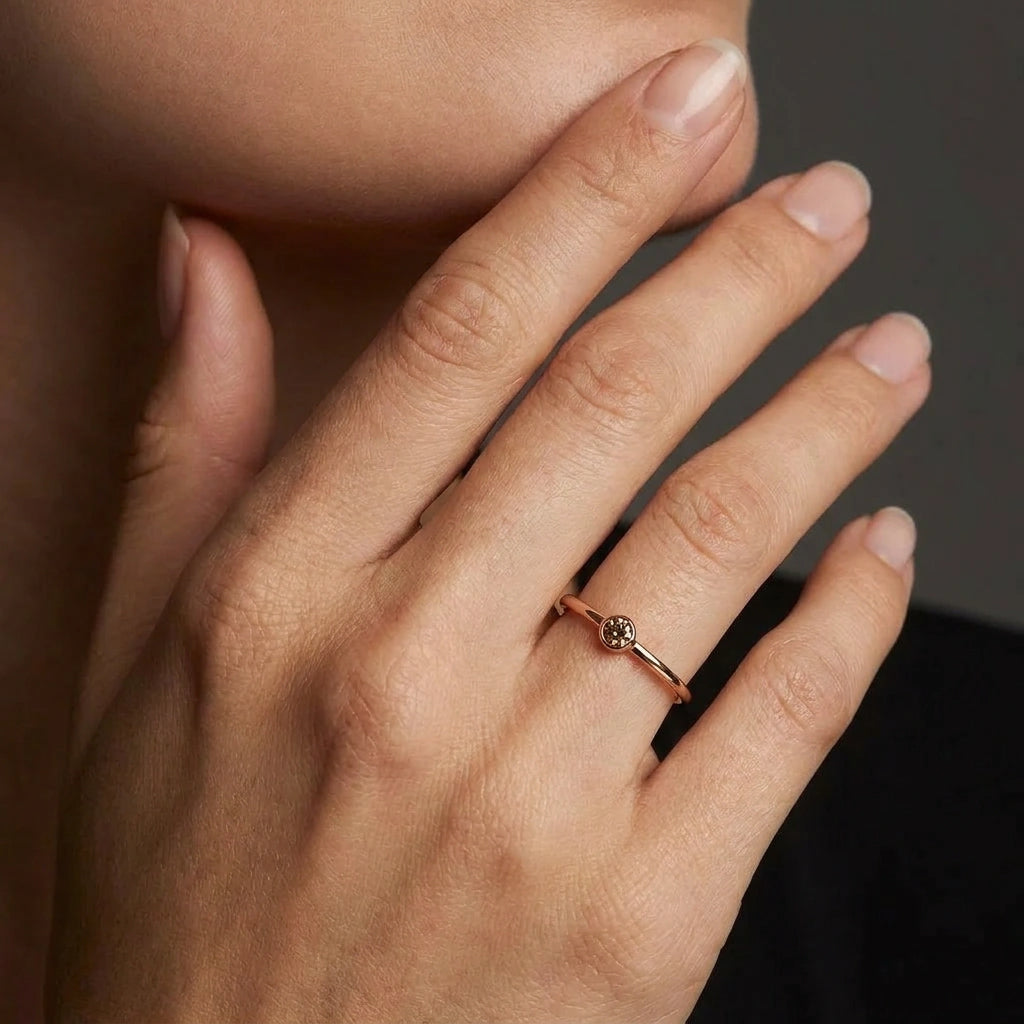 Cognac diamond bezel stacking ring in 14K brown gold worn on hand — Black Pearl of Queens