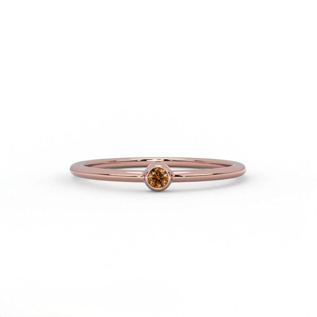 Natural cognac diamond bezel-set stacking ring in 14K rose gold, front view — Black Pearl of Queens