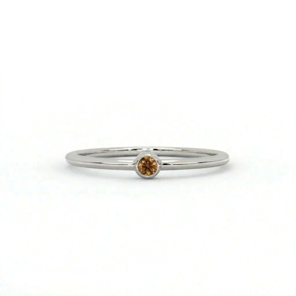 Natural cognac diamond bezel-set stacking ring in 14K white gold, front view — Black Pearl of Queens