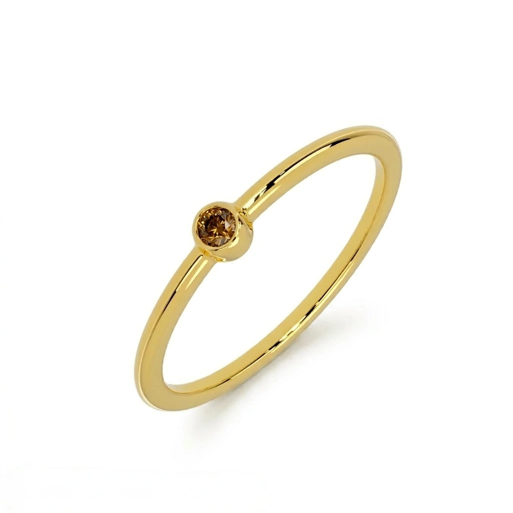 Cognac diamond bezel-set stacking ring in 14K yellow gold, three-quarter angle — Black Pearl of Queens
