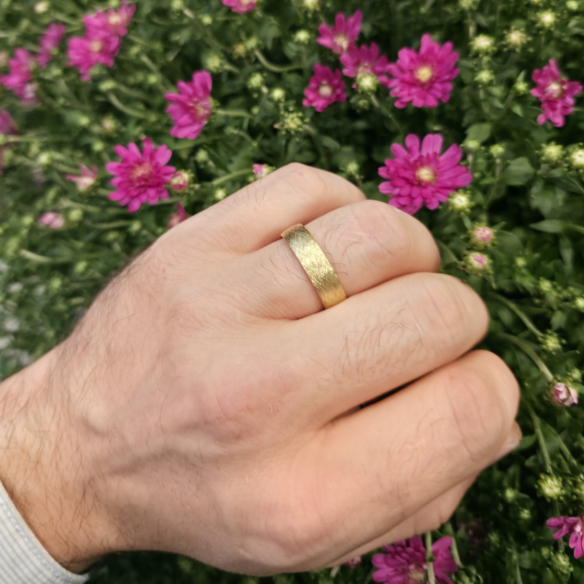 Brushed gold wedding band in 14K on hand outdoors, 6mm comfort fit ring by Black Pearl of Queens